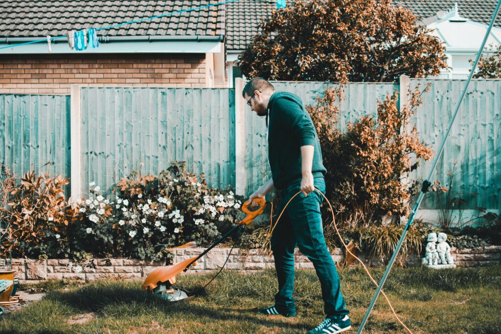 teen doing yard work as a side hustle