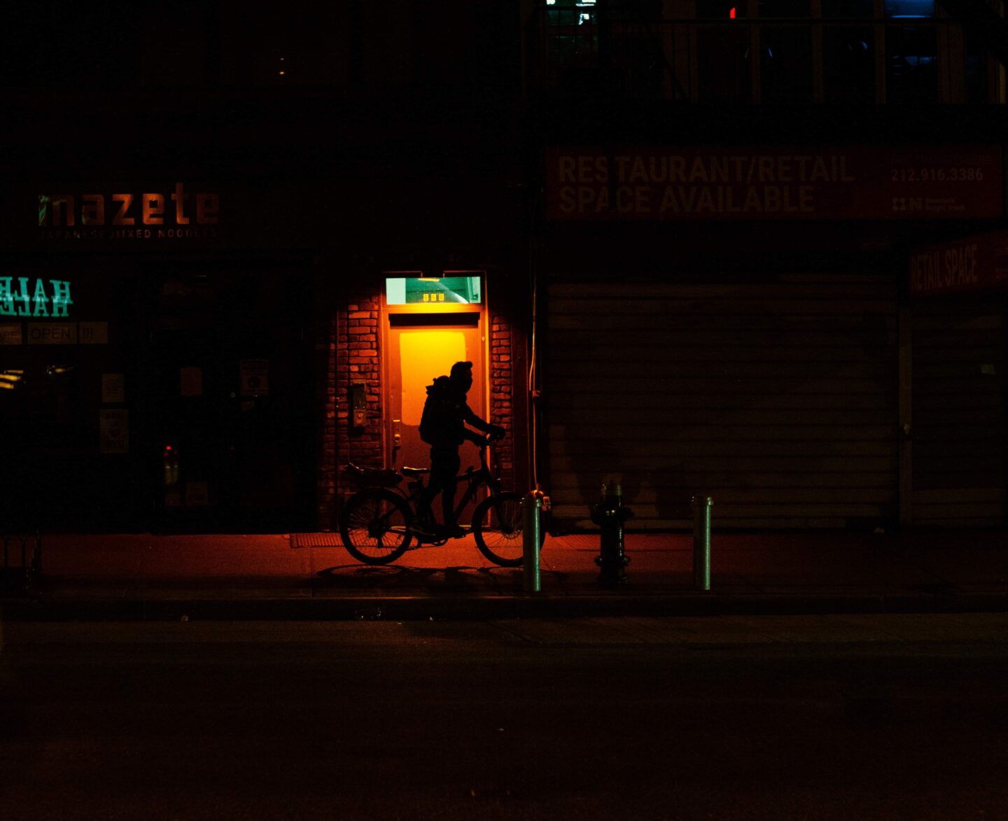 Bouy standing in the strk with his bike